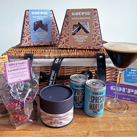 Gourmet vegan chocolate gift basket with coffee, chocolate, and a glass of espresso martini
