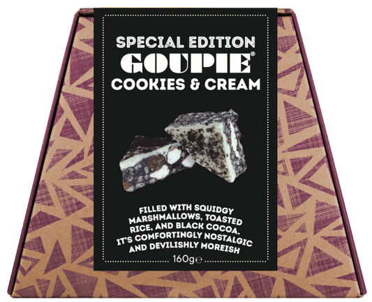 A box of limited edition cookies and cream Goupie, featuring a tan and purple geometric patterned box with a black central label showing a two pieces of cookies and cream goupie.