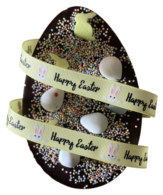 Decorative Easter egg with 'Happy Easter' ribbon and small eggs inside