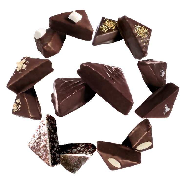 an assortment of chocolate goupie displayed in a ring, featuring orange, salted sticky toffee, cherry and almond, tiramisu, hazelnut, lemon meringue, and original