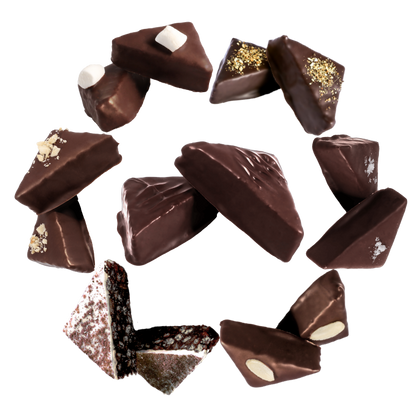 an assortment of chocolate goupie displayed in a ring, featuring orange, salted sticky toffee, cherry and almond, tiramisu, hazelnut, lemon meringue, and original