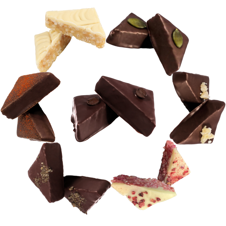 an assortment of chocolate goupie displayed in a ring, featuring sesame butter, ginger, white chocolate and raspberry, mint, chilli, white chocolate and cardamom and espresso.